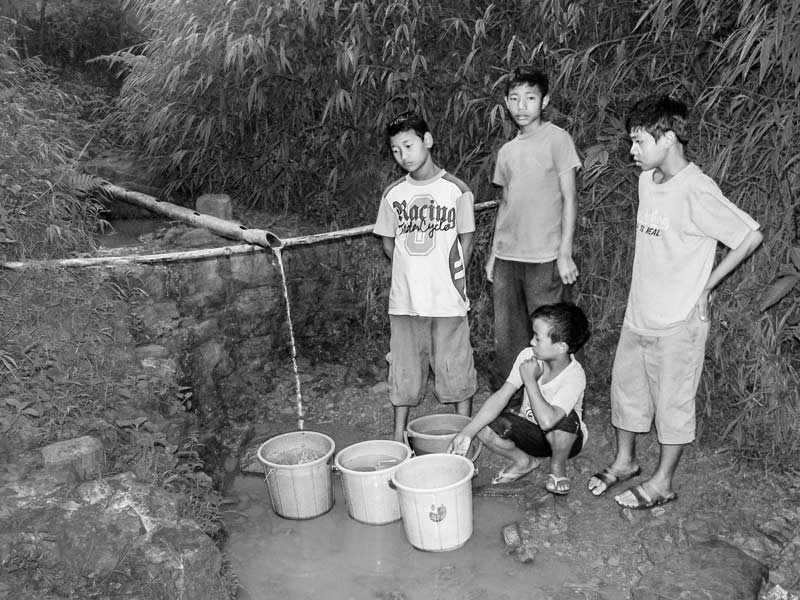 Human Right to Water in Nagaland - Children of a residential school procuring water for daily use from a distant source in Mon district